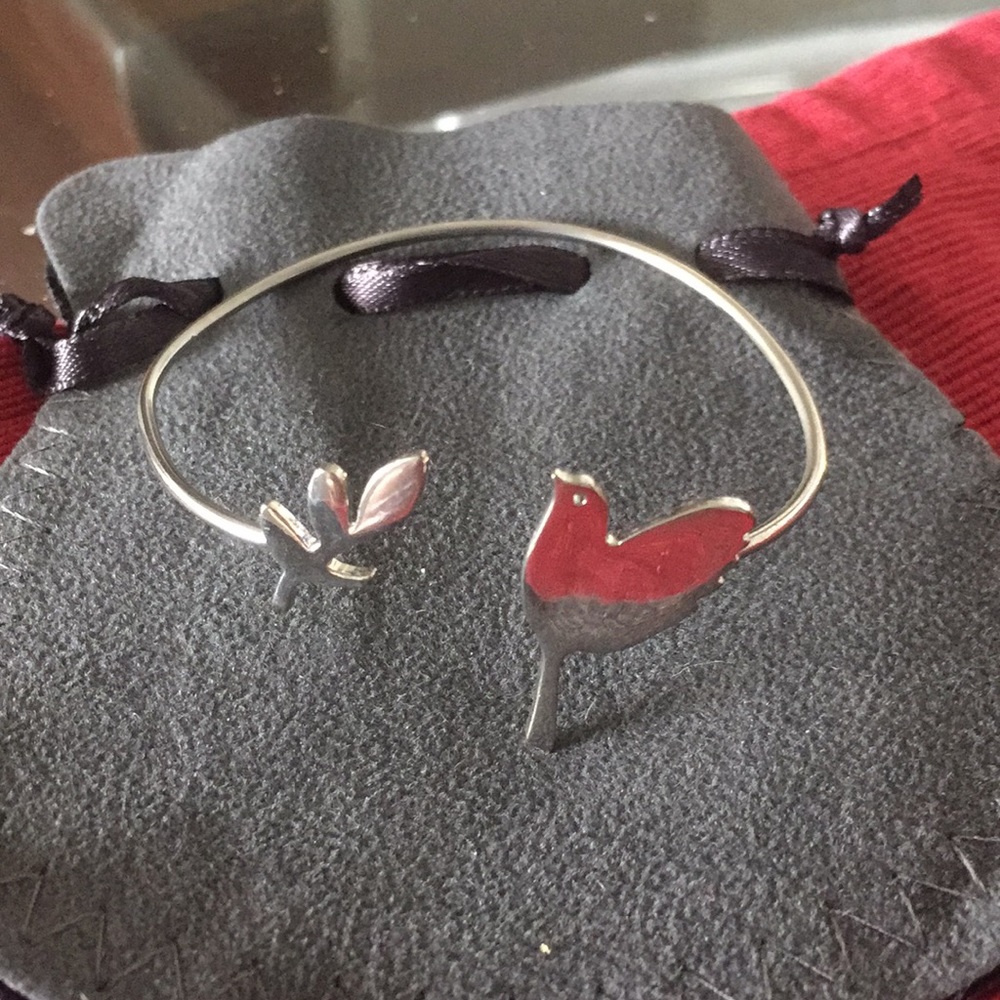 Silver bracelet with bird and leaf